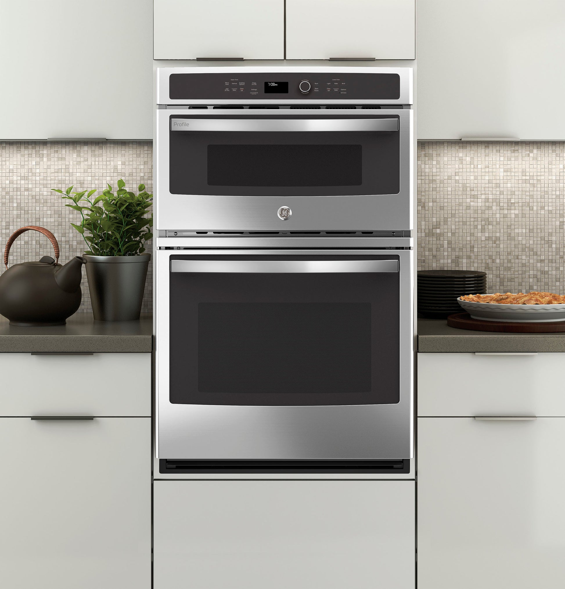 Front view of a stainless steel built-in combination convection microwave and wall oven in modern kitchen setting