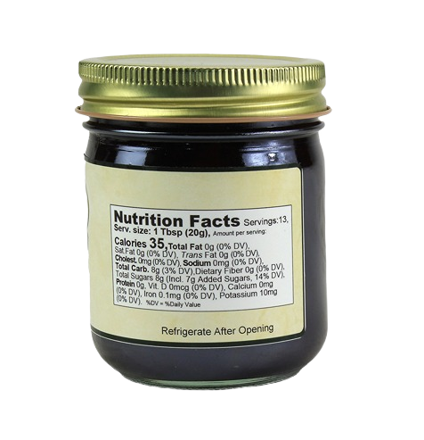 Glass jar showing nutrition facts label of Hartville Kitchen fruit sweetened blackberry spread in jams and jellies collection