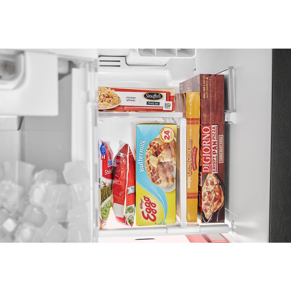 Open freezer compartment with frozen food items including waffles, pizza, and ice cubes for kitchen appliances