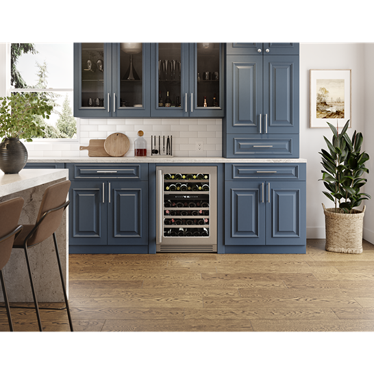 Built-in 24-inch stainless steel wine cooler with glass door and wood shelving in modern kitchen cabinetry setting