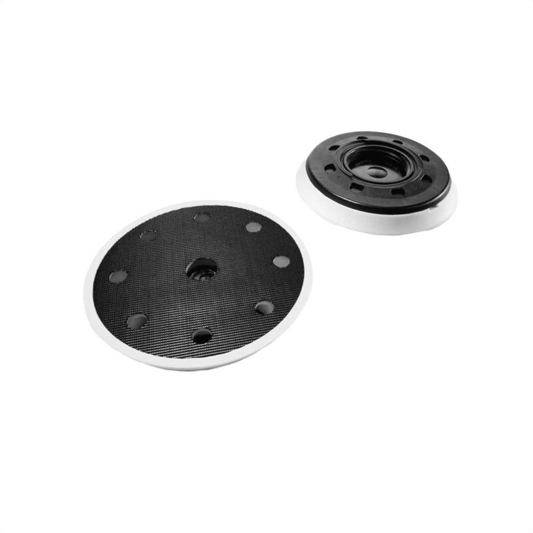 Soft black and white sanding pad with holes designed for rotary or random orbit sanders in woodworking tools and accessories