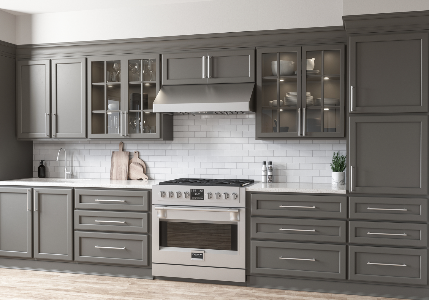 Sleek stainless steel under-cabinet range hood with LED lighting and pro baffle filters mounted above a gas cooktop in a modern kitchen, featured in Range Hoods, Kitchen & Kitchenware, All Products, and Appliances collections.
