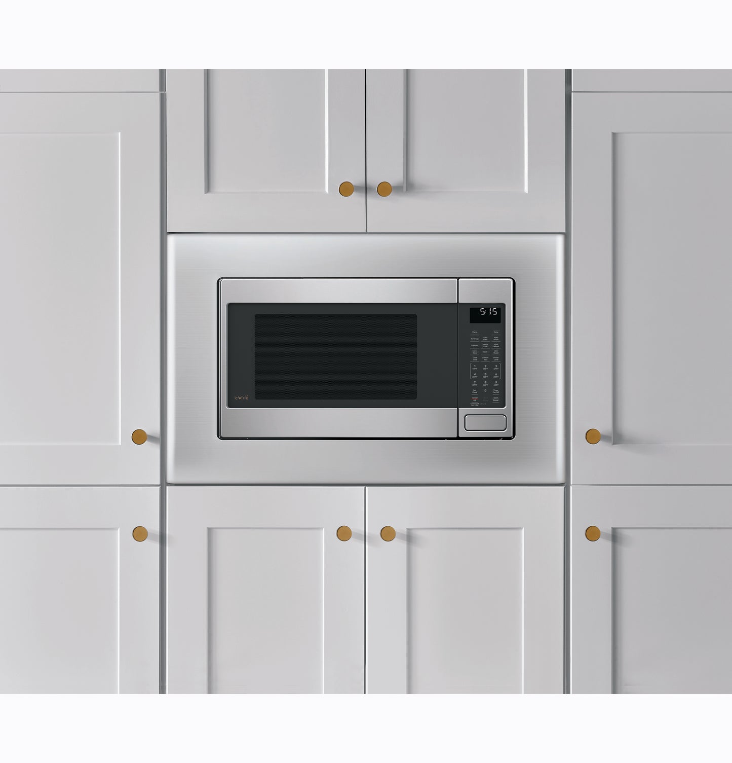 Built-in stainless steel smart countertop convection microwave oven integrated within white kitchen cabinetry.