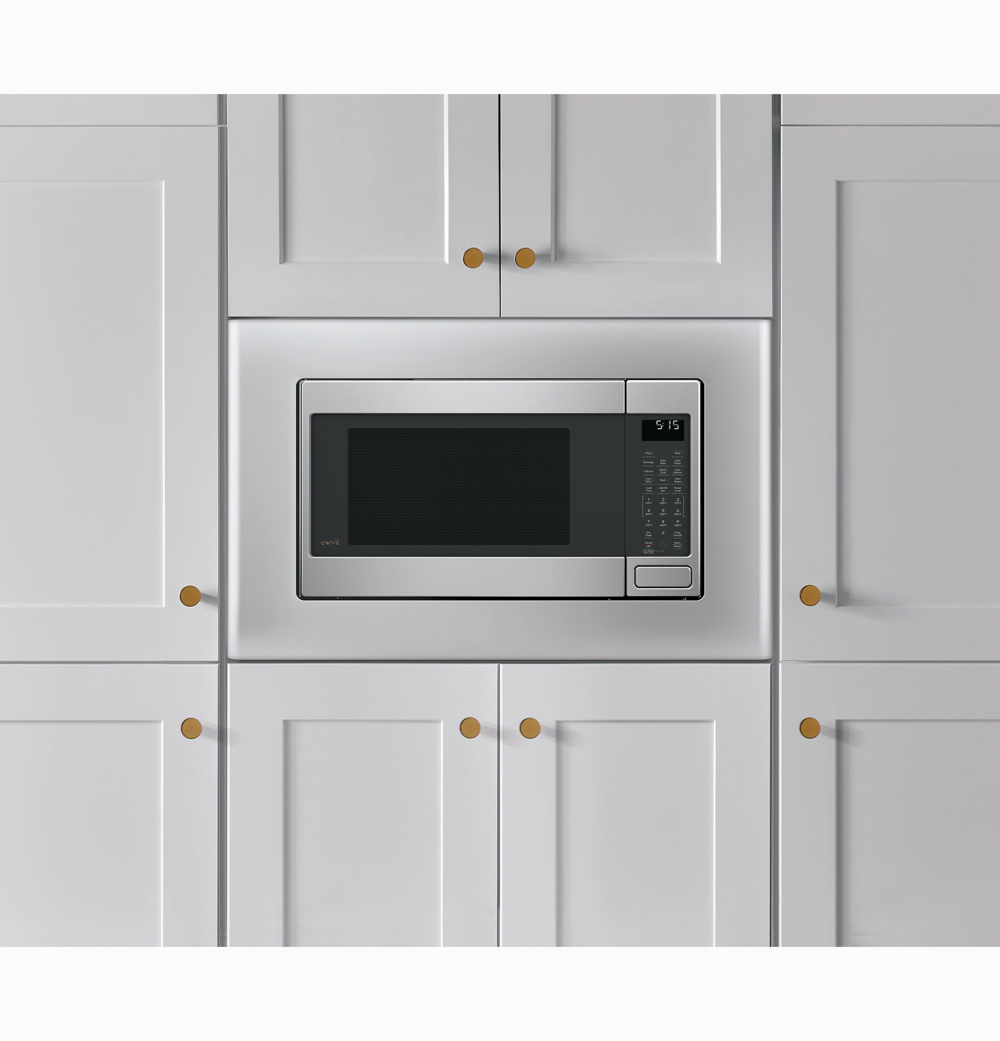 Built-in stainless steel smart countertop convection microwave oven integrated within white kitchen cabinetry.