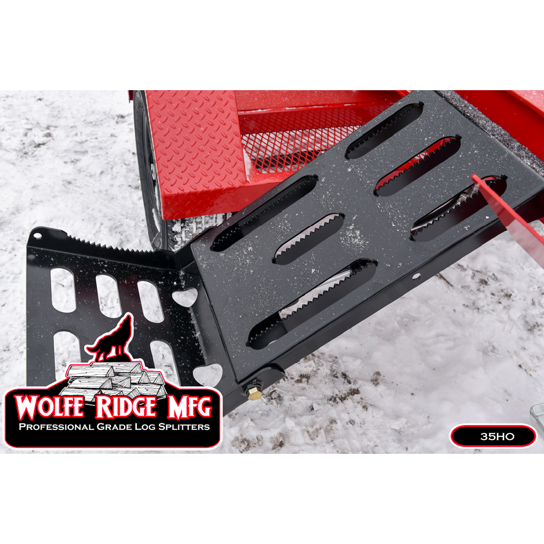 Close-up of heavy-duty metal log splitter push block with serrated gripping edges on snowy ground outdoors