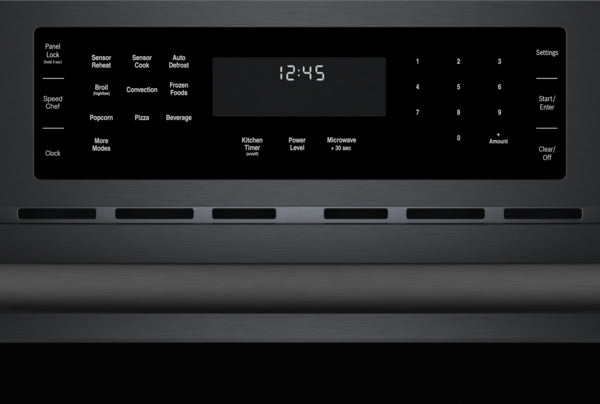 Black stainless steel speed oven control panel with digital clock and multiple cooking function buttons in kitchen appliances collection
