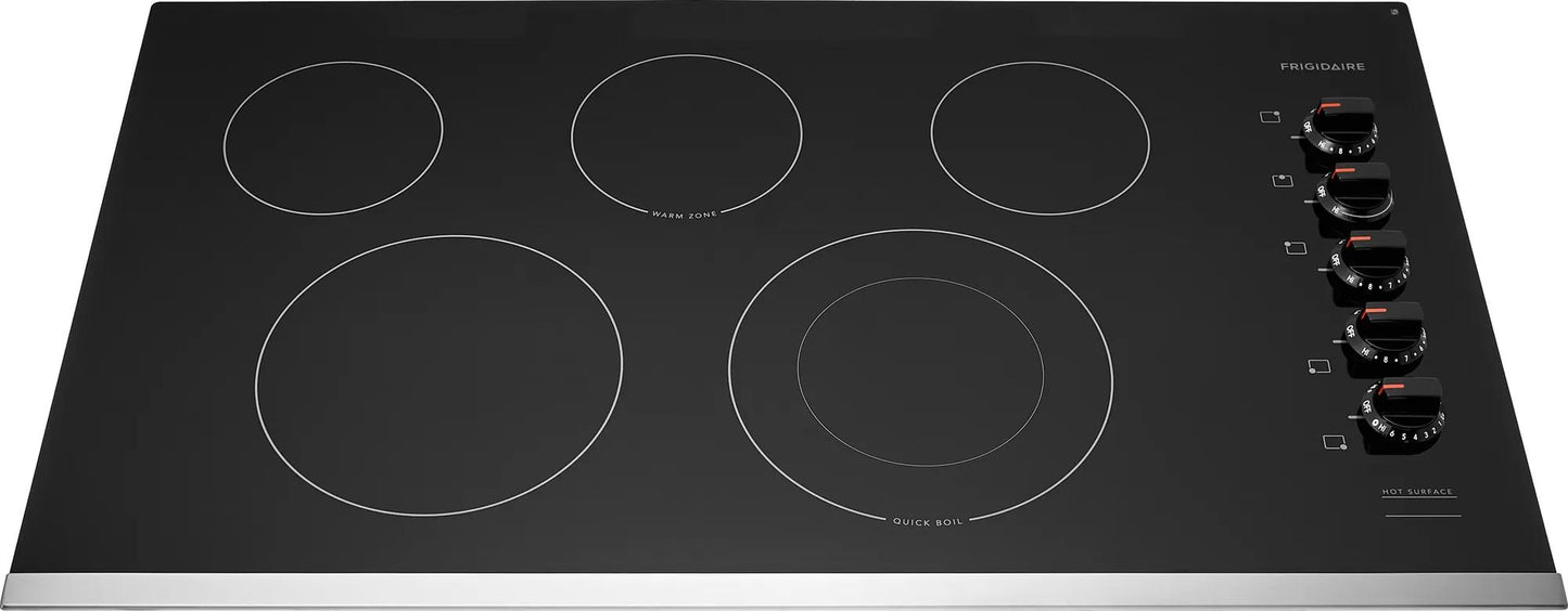 Black 36-inch electric cooktop with five cooking zones and control knobs for kitchen and appliance collections