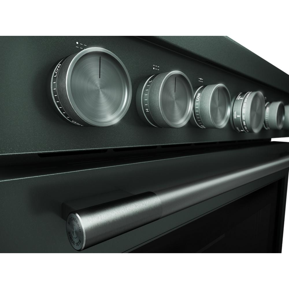 Close-up of brushed stainless steel control knobs and handle on black commercial-style KitchenAid dual fuel range