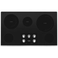 36-inch black ceramic glass cooktop with five burners and central control knobs in kitchen appliances collection