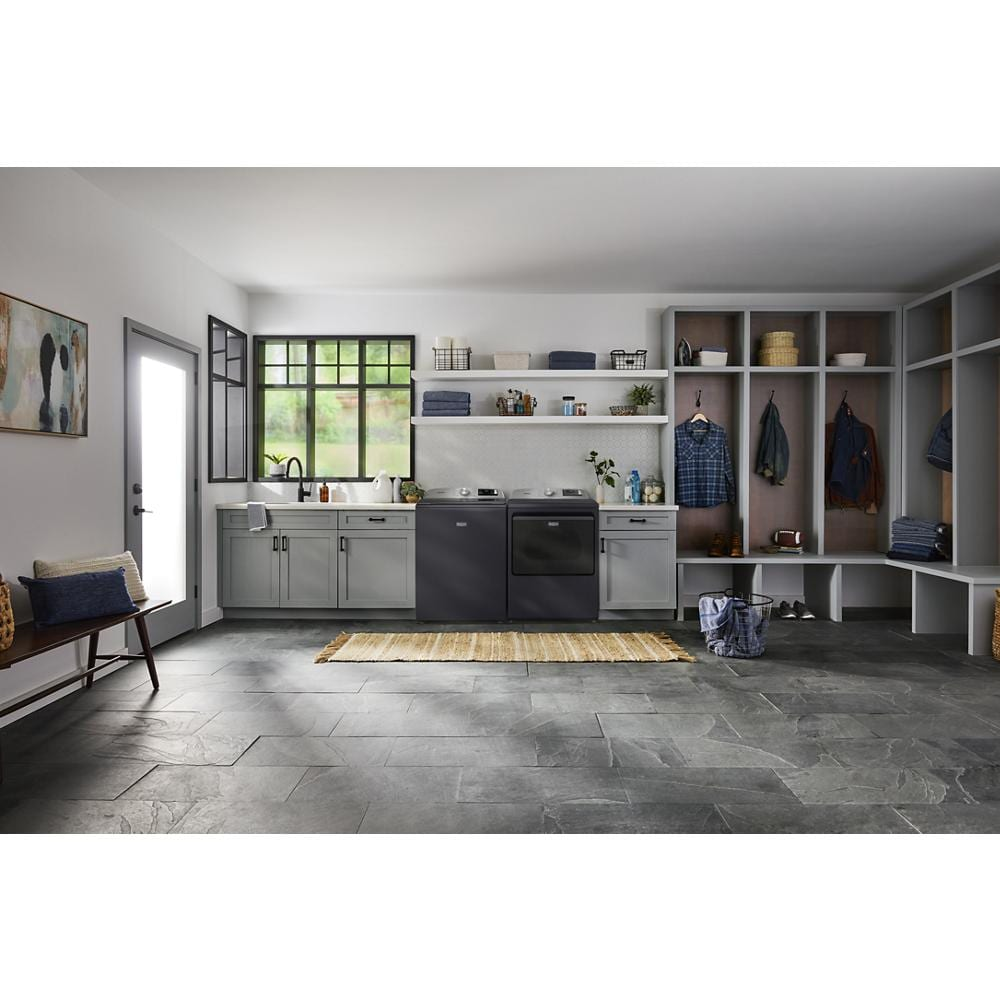 Modern laundry room featuring gray cabinetry with a matching dark gray top load gas dryer and washer from Dryers collection