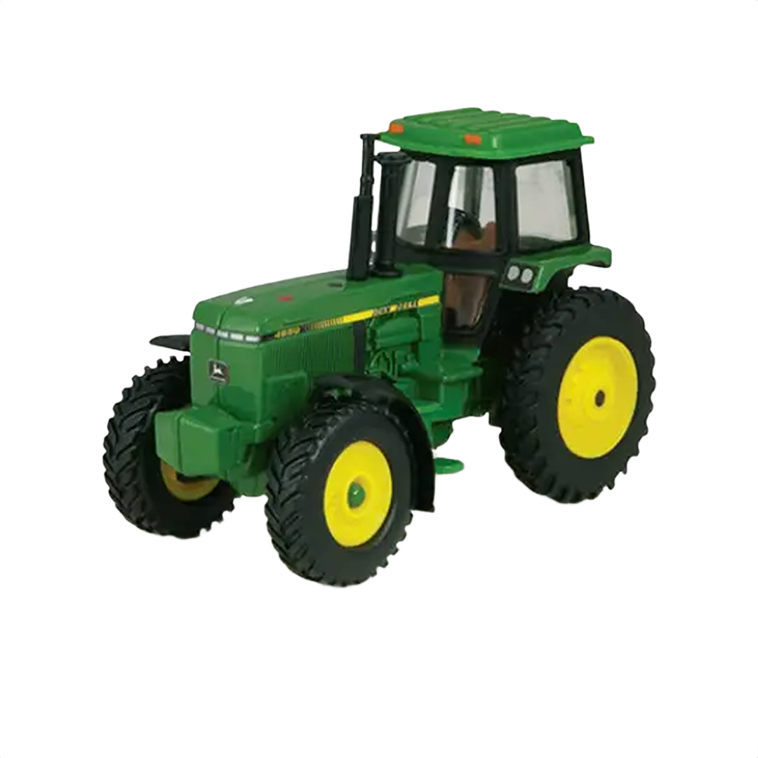 Green and yellow vintage 1:64 scale tractor toy with cab, detailed wheels, and realistic design features