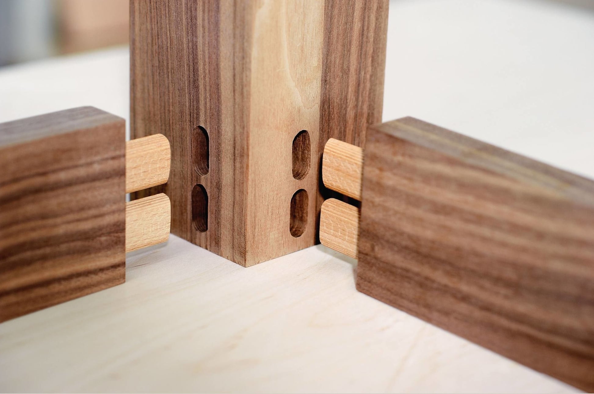 Close-up of precision woodworking joints connecting hardwood pieces for woodworking tools and power tools collections