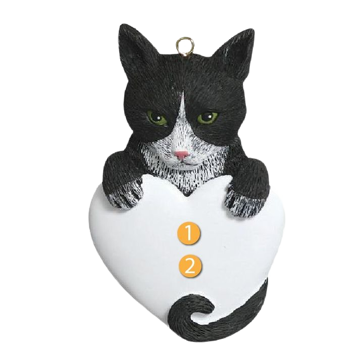 Black and white tuxedo cat holding a heart-shaped ornament in Christmas Ornaments & Tree Decorations collection