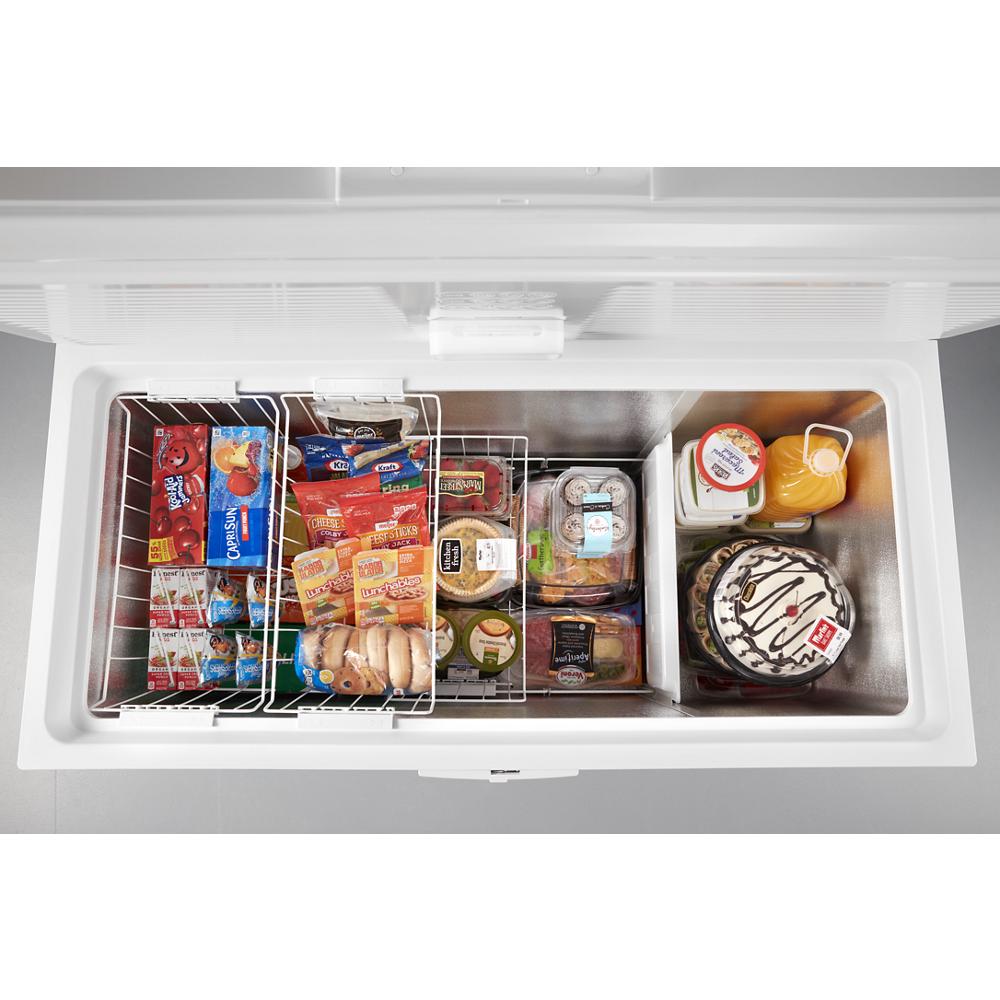 Top view of chest freezer with organized frozen meals, ice cream cake, and juice from Freezers & Ice Makers collection
