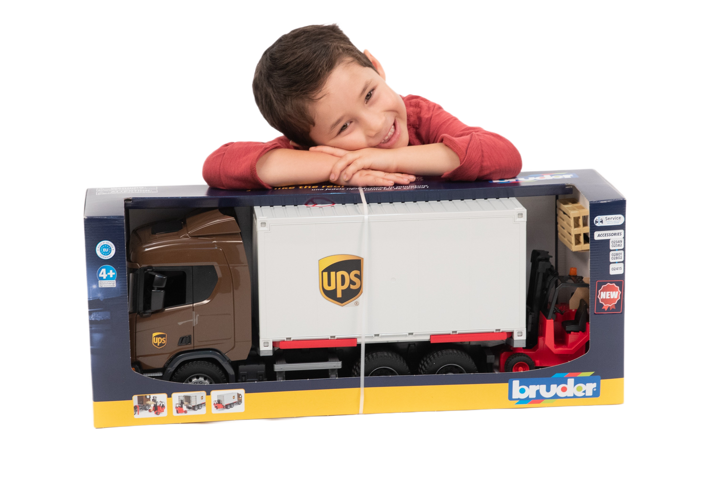 Child playing with a detailed Bruder UPS logistics toy truck and forklift from the Vehicles & Remote Controlled Toys collection