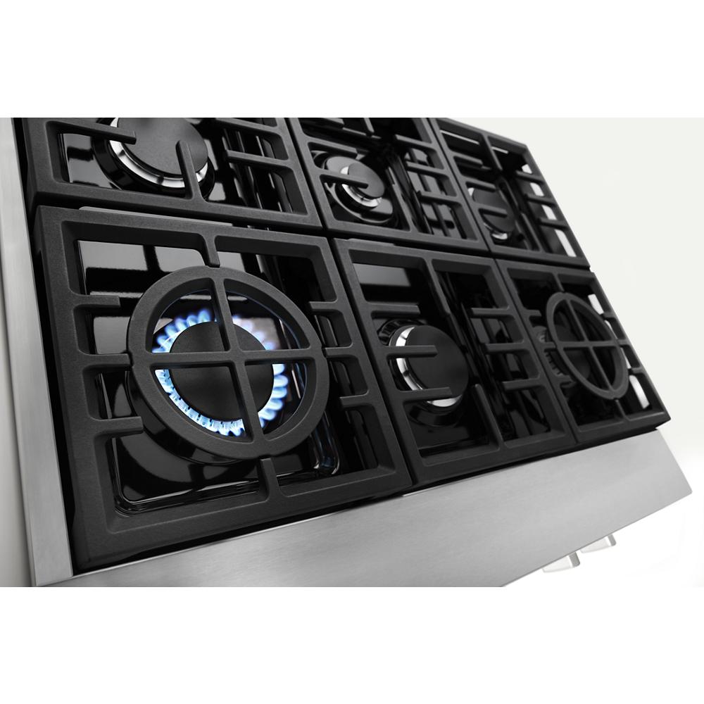 Six-burner commercial-style gas rangetop with cast iron grates and one burner lit, from Kitchen & Kitchenware collection