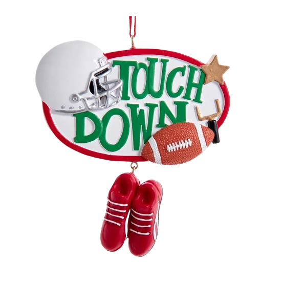 Christmas ornament featuring football helmet, ball, cleats, and touchdown lettering in festive green and red colors