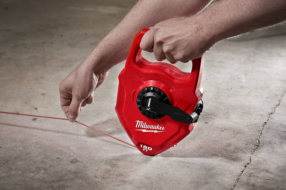 Hand Tools measuring tool in use with red large capacity chalk reel for woodworking and home improvement projects