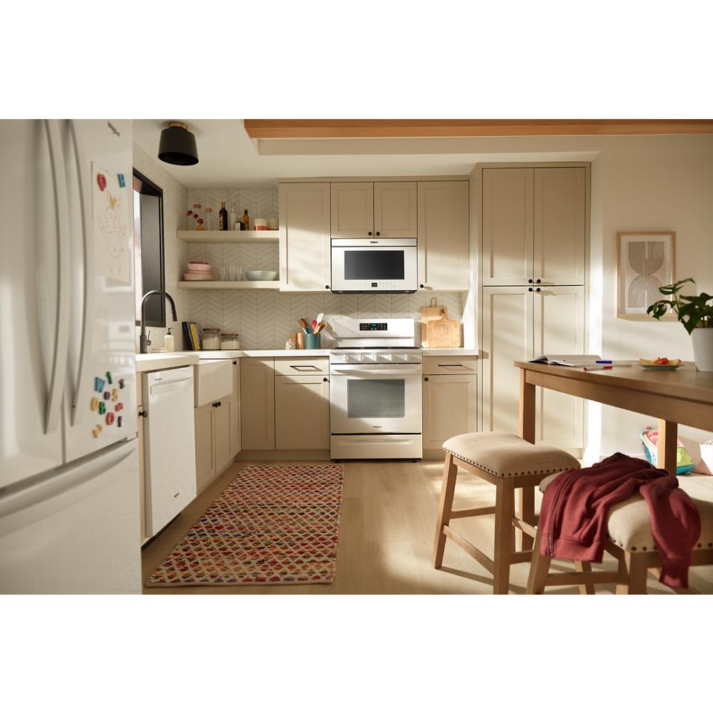 Bright kitchen with beige cabinetry and flush built-in air fry over-the-range oven from Appliances collection
