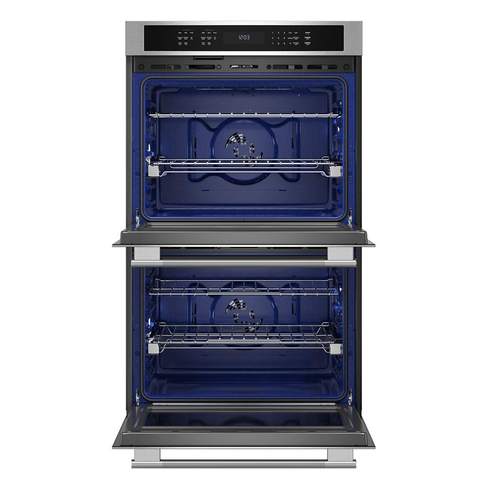 Electric double wall oven with open doors showing blue interior and control panel for KitchenAid appliances collection