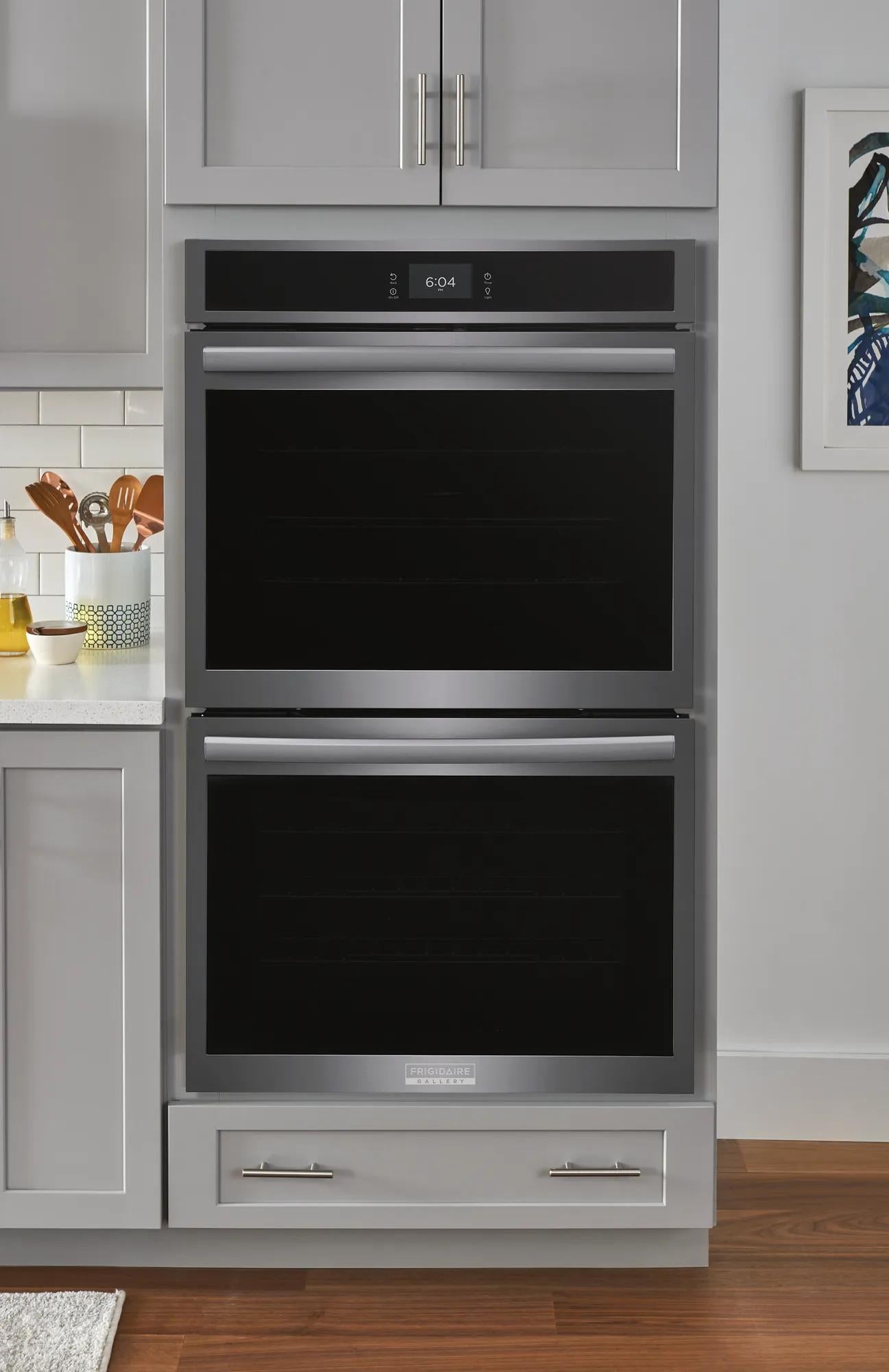 Built-in stainless steel 30" double electric wall oven with total convection in modern gray kitchen cabinetry