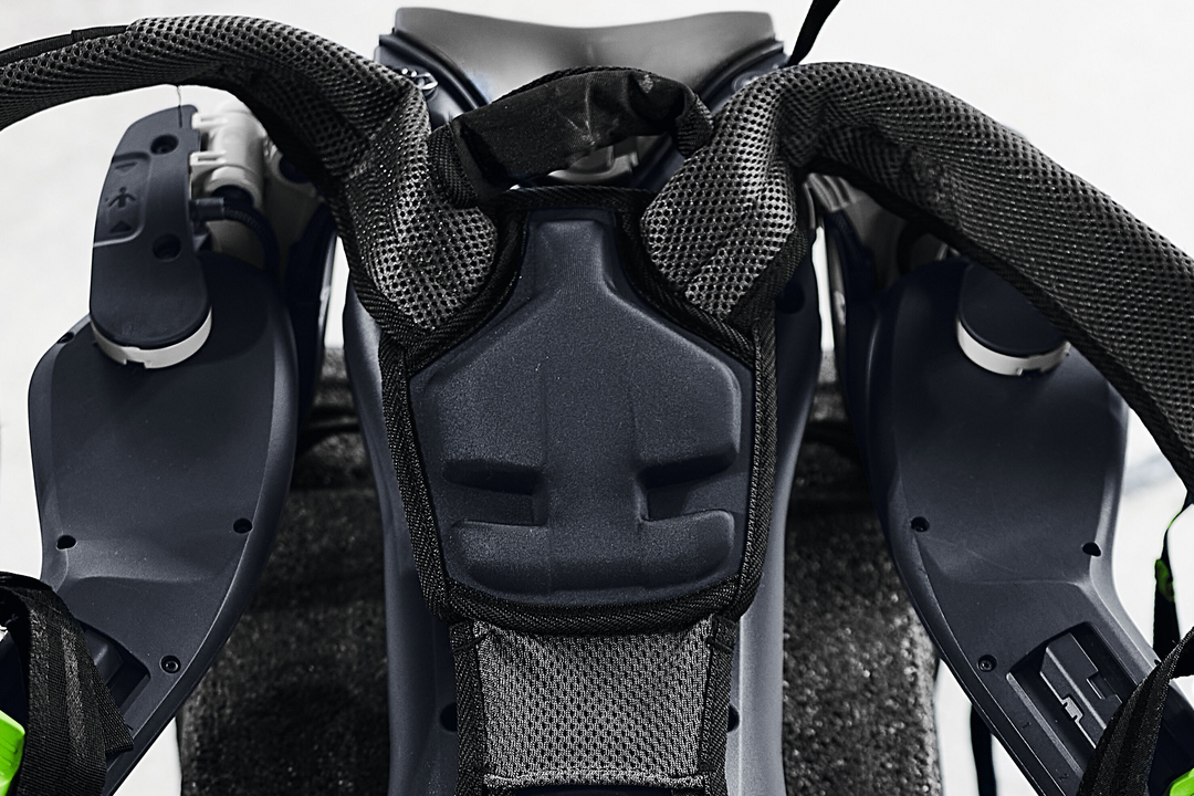 Close-up of black ergonomic support harness with breathable padding and adjustable straps in power tool accessories collection