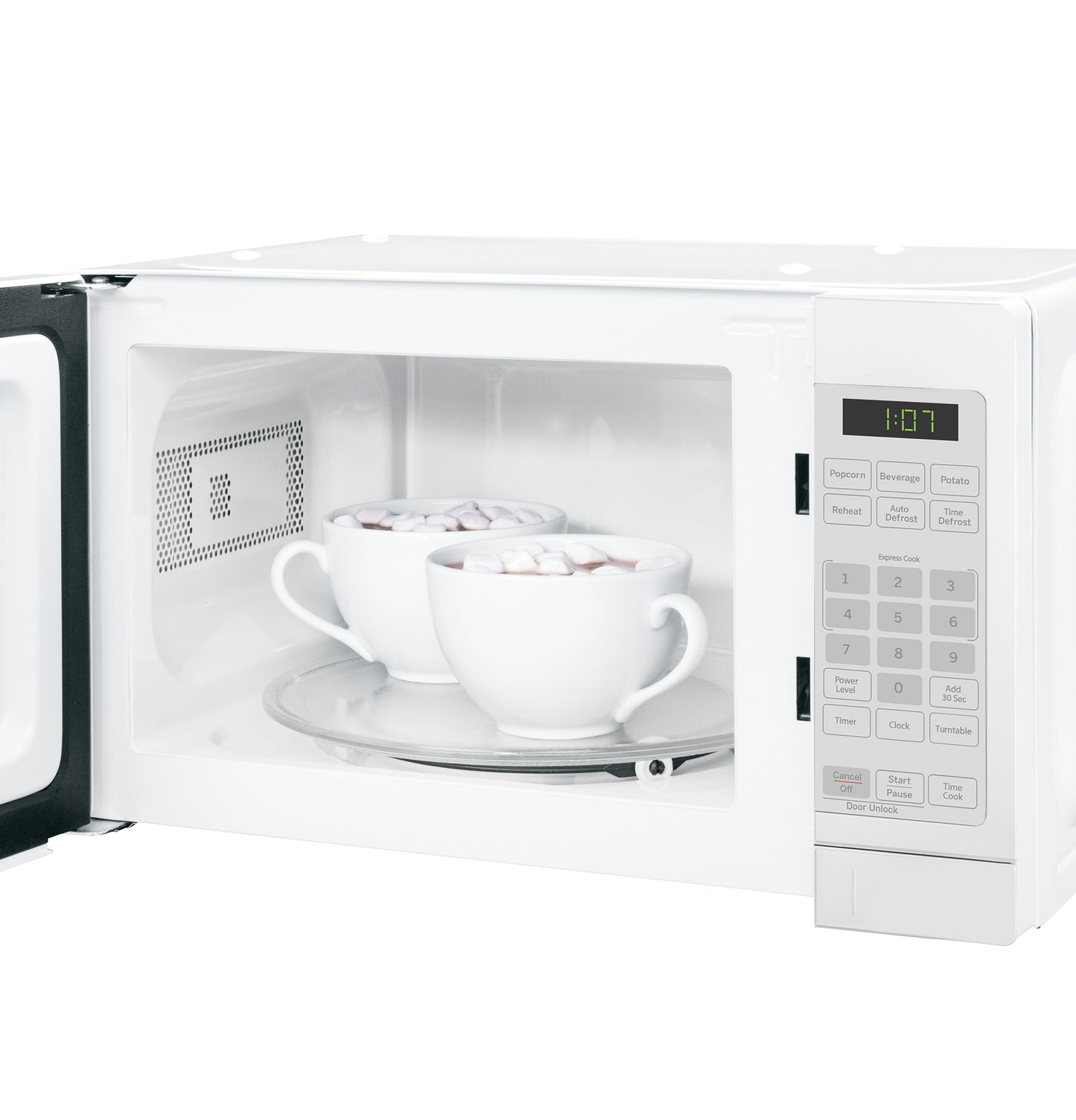 White countertop microwave oven with open door showing two mugs inside on a glass turntable in kitchenware setting