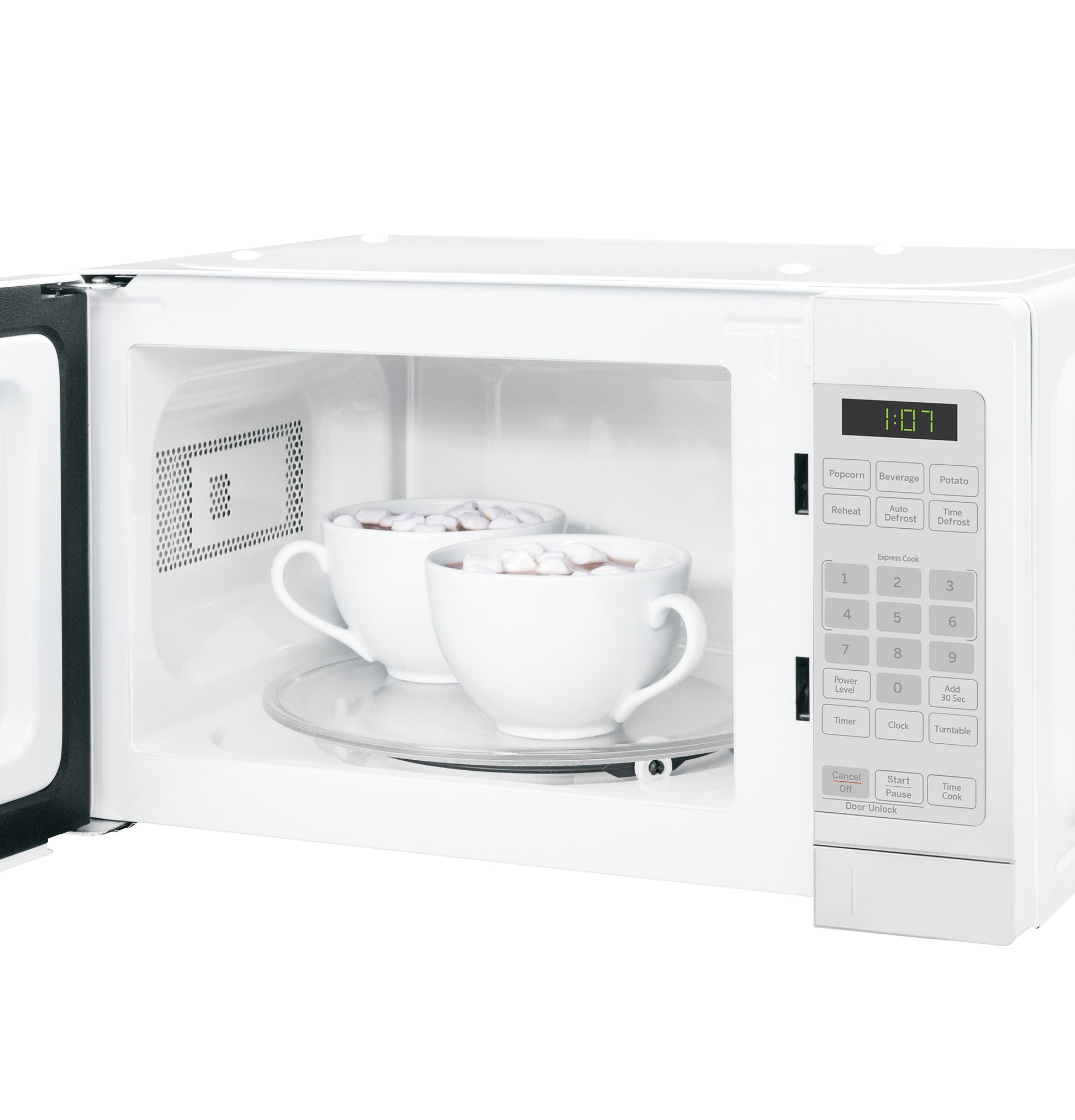 White countertop microwave oven with open door showing two mugs inside on a glass turntable in kitchenware setting