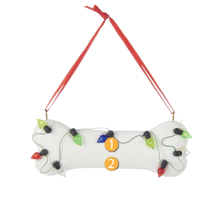 White dog bone ornament decorated with colorful Christmas lights, perfect for holiday tree decorations under $50 collections