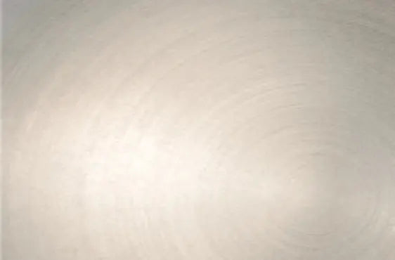 Smooth brushed metal surface with subtle circular patterns and a light, reflective finish suitable for home improvement and lighting applications.