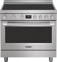 Front view of stainless steel freestanding induction range with digital display and control knobs in kitchen appliances collection
