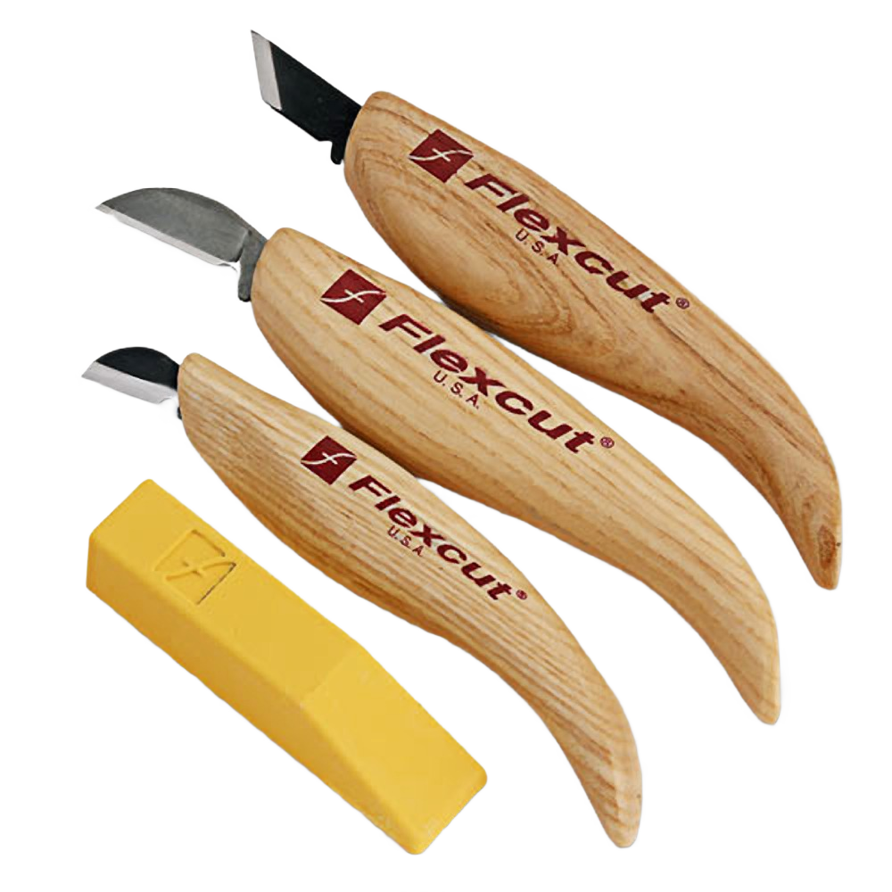 Three wood-handled carving knives with sharp stainless steel blades and a yellow safety sheath in woodworking tools collection