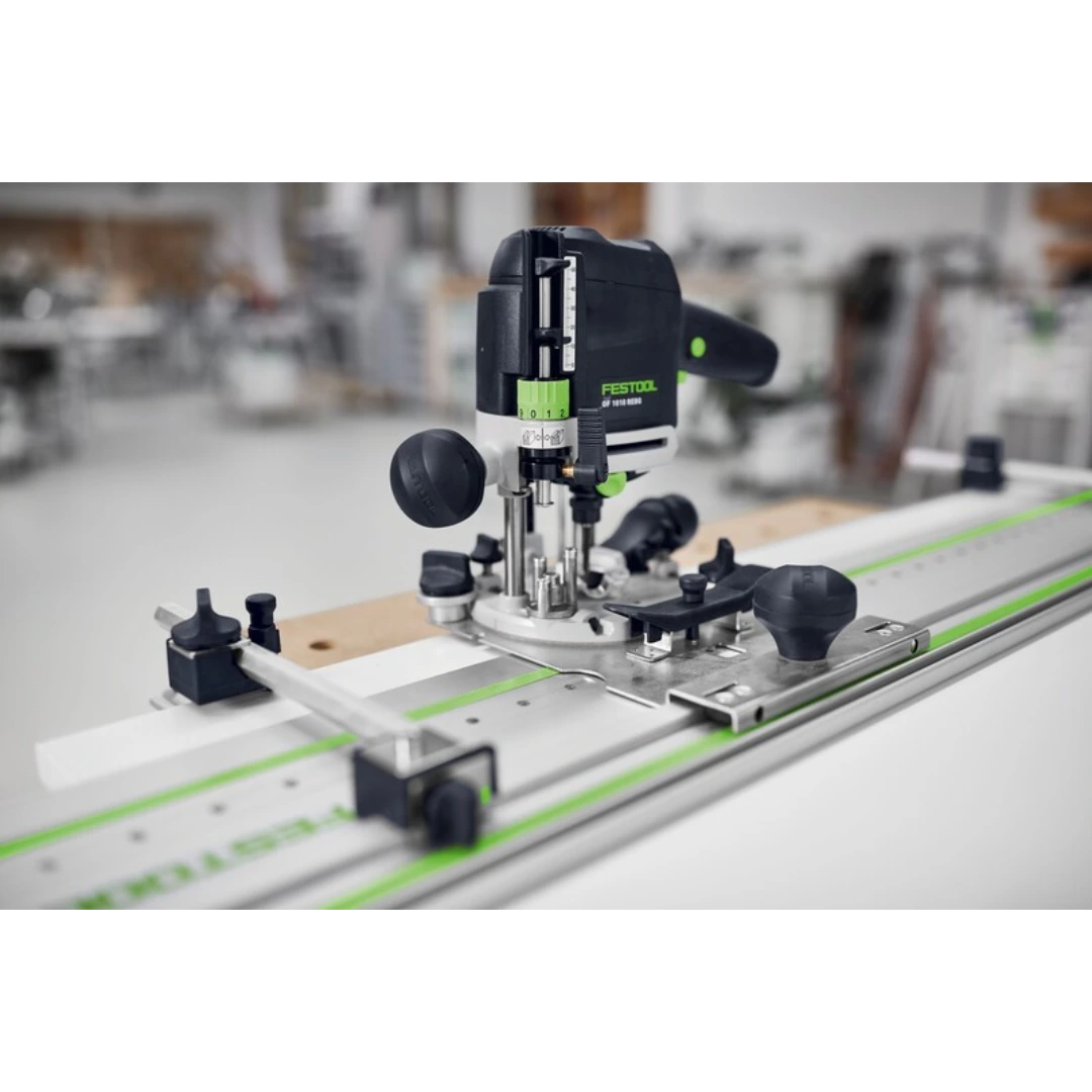 Festool plunge router mounted on aluminum guide rail system for precise woodworking and home improvement projects