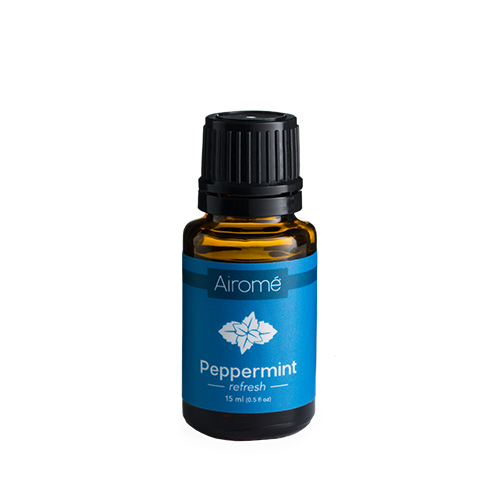 Amber glass bottle of peppermint essential oil with blue label, ideal for home decor and under $50 collections