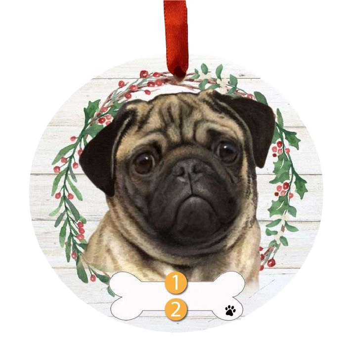 Round Christmas ornament with a realistic pug face and festive holly wreath on a white wood background