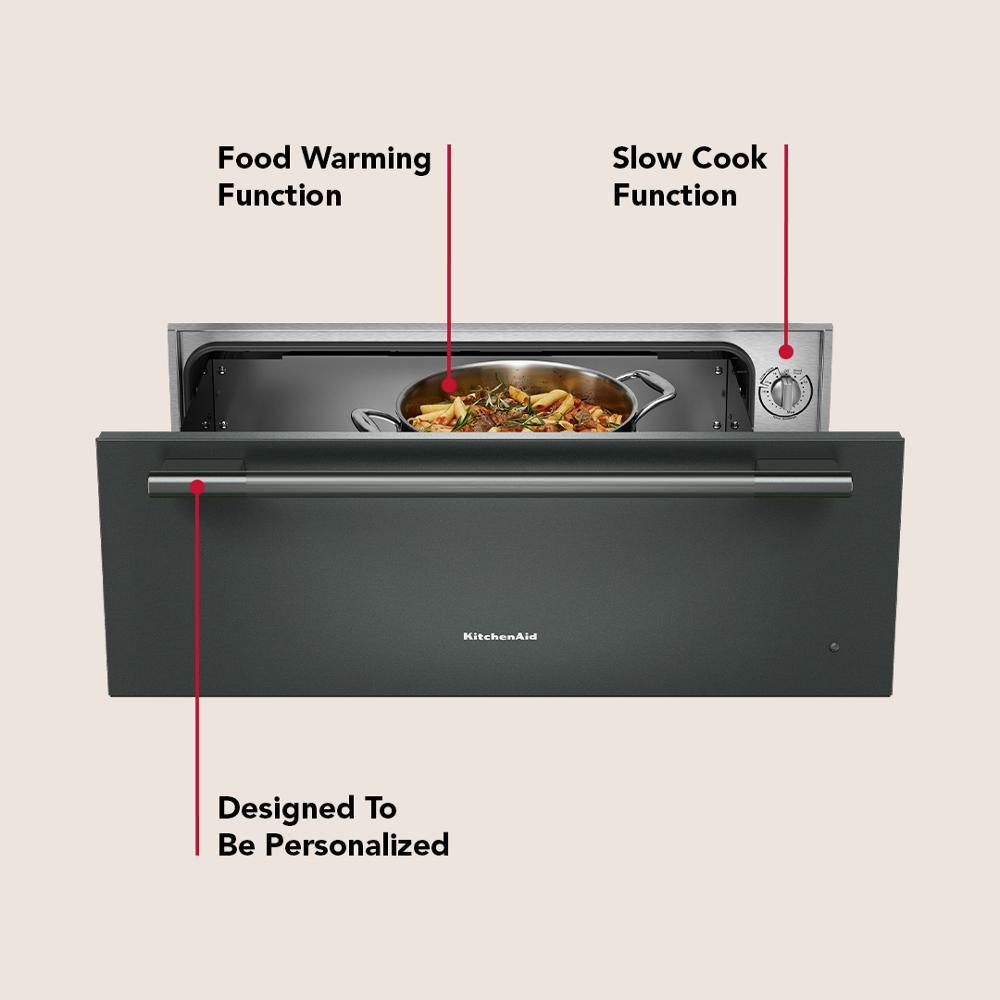 Matte black slow cook warming drawer with stainless steel handle showing adjustable control knob for KitchenAid appliances