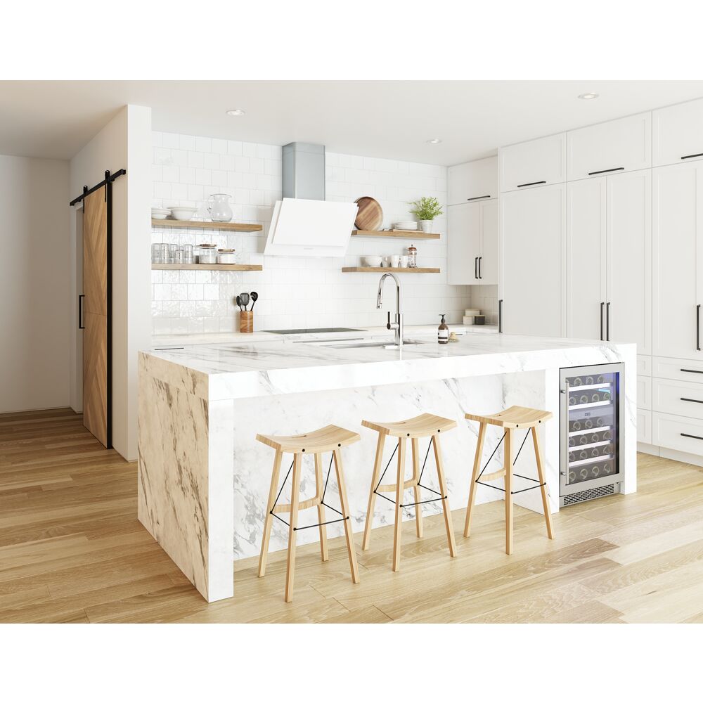 Modern kitchen with white angled wall hood, marble island with wooden stools, built-in wine cooler, and hardwood flooring