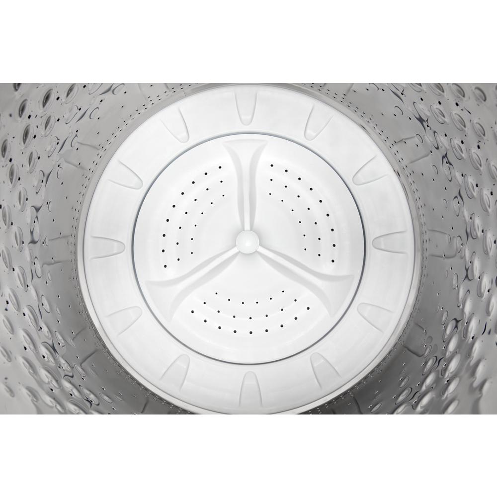 Top-down view of a stainless steel drum interior with perforations in a home appliance from the dryers collection