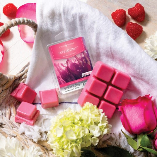 Pink wax melts pack with six square cubes surrounded by fresh flowers and berries for home fragrance