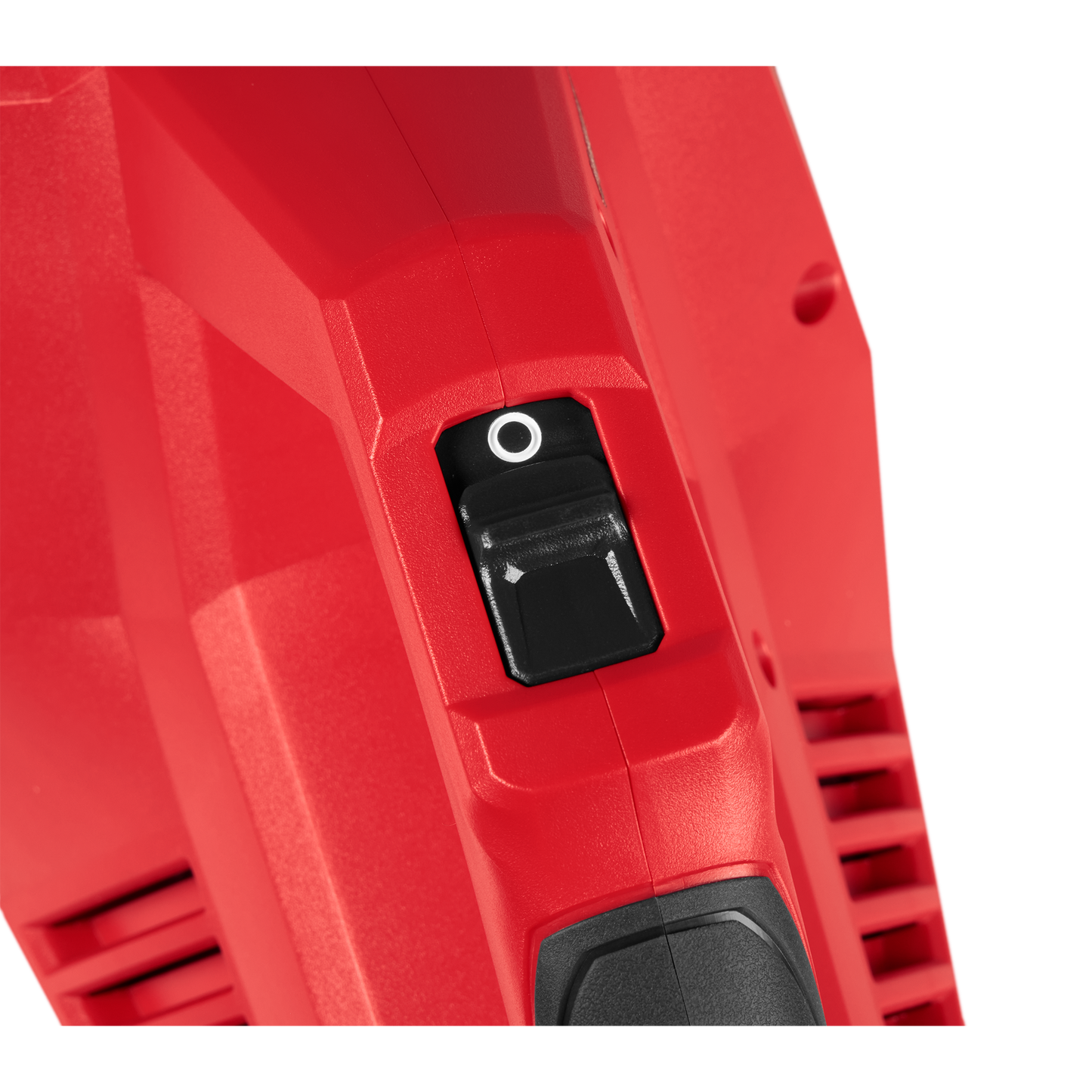 Close-up of black power switch on red Milwaukee M18™ Brushless Handheld Vacuum, part of cleaning supplies and handheld vacuums at Hartville Hardware.