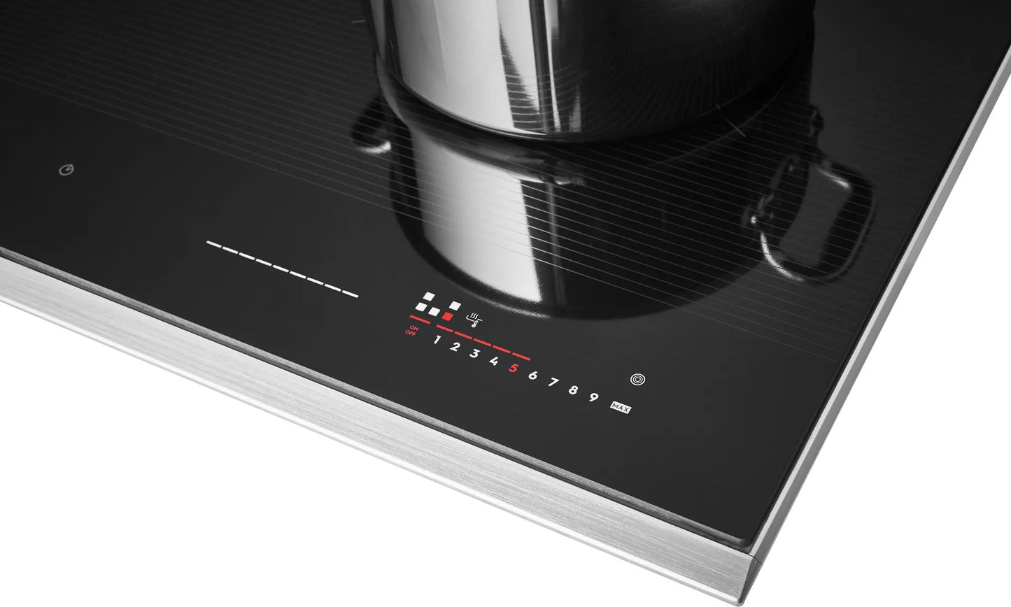 Close-up of a black induction cooktop with temperature control and touch slider on a stainless steel trim