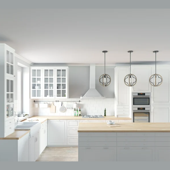 Three rustic iron and French oak pendant lights with quatrefoil design over a modern white kitchen island and cabinetry