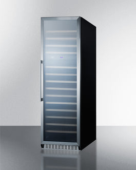 Sleek 24-inch black wine cellar with glass door and wooden slide-out shelves in modern kitchen appliances setting