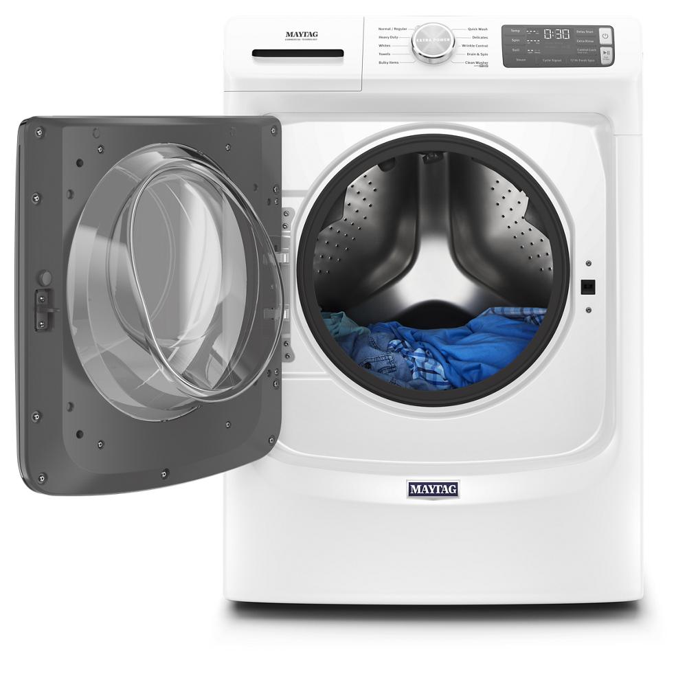 White front load washer with open door showing stainless steel drum and blue clothing in washers and appliances collection