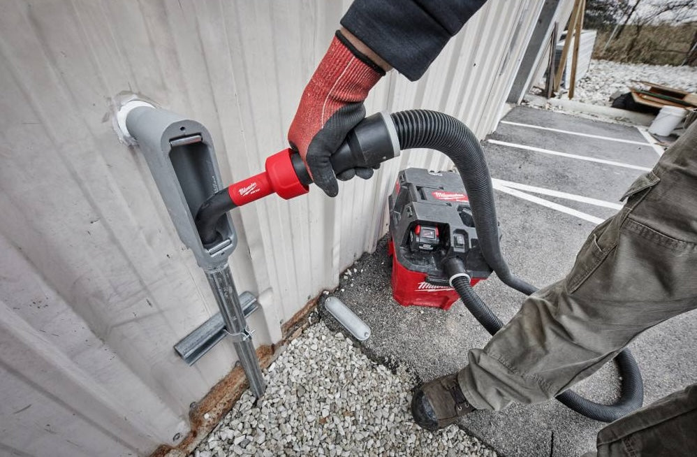 Milwaukee AIR-TIP™ conduit line puller in use with vacuum hose for electrical and woodworking tasks