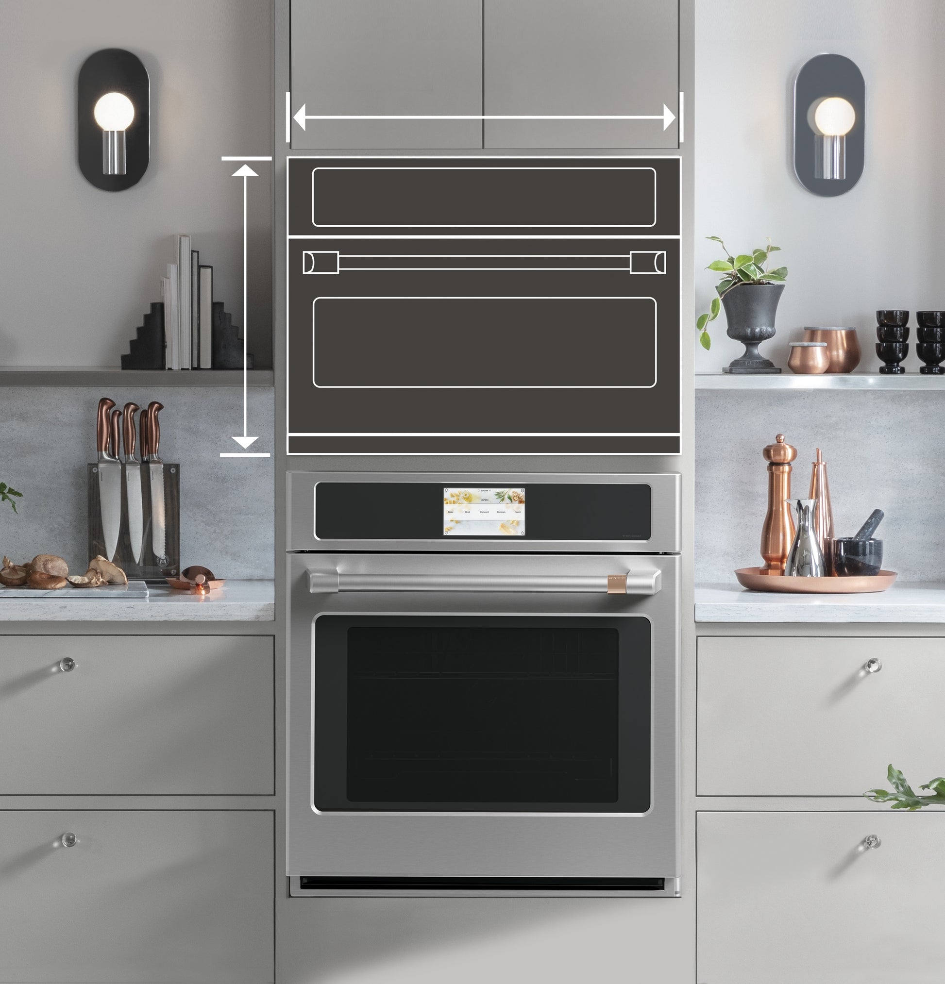 Built-in stainless steel single wall oven installed in modern kitchen cabinetry with decorative accents and lighting