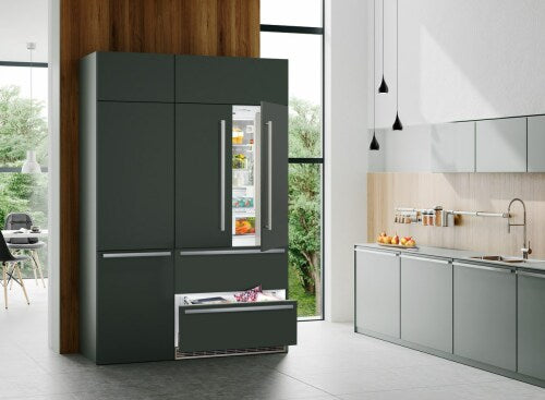 Built-in dark green French door refrigerator with open freezer drawer in modern kitchen appliances and refrigeration collection