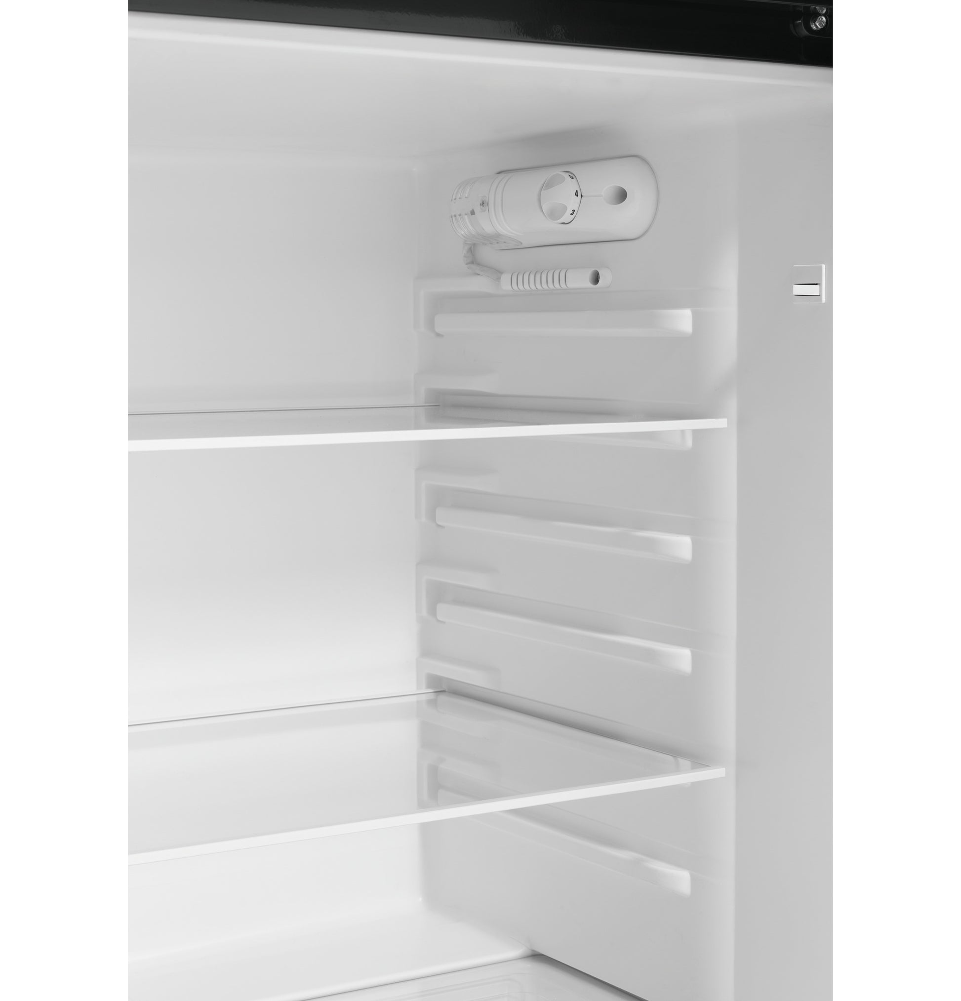 Interior of white top-freezer refrigerator with adjustable glass shelves and digital temperature control from Refrigerators collection