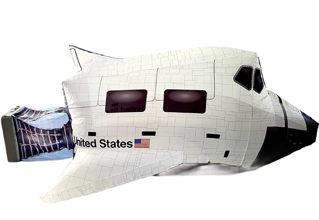 Inflatable space shuttle play structure with United States flag for children's indoor and outdoor recreation.