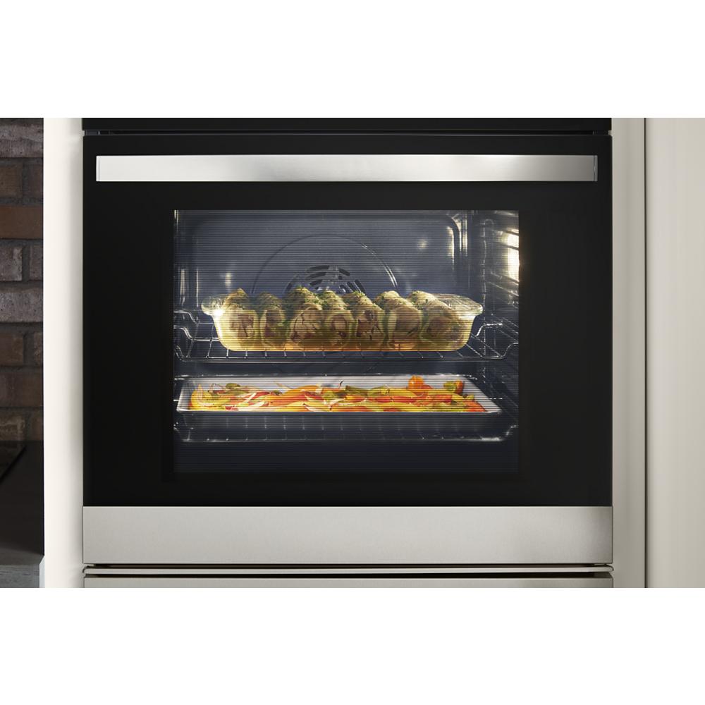 Stainless steel wall oven from Kitchen & Kitchenware collection baking stuffed rolls and roasted vegetables inside